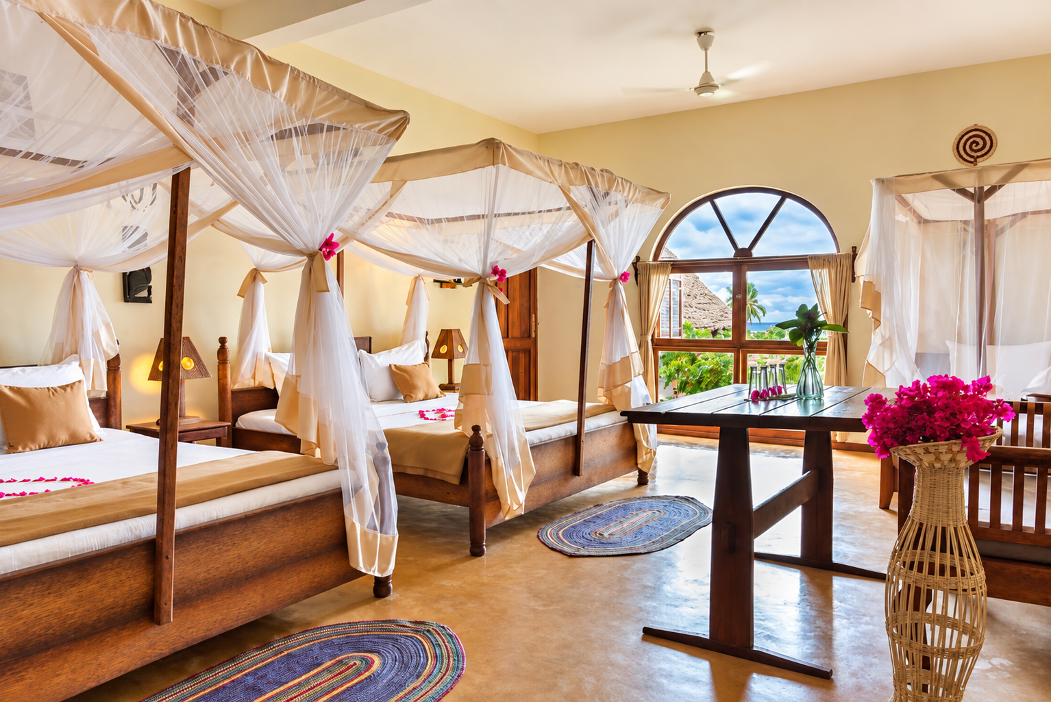 Standard double room with mosquito-net beds and an ocean view