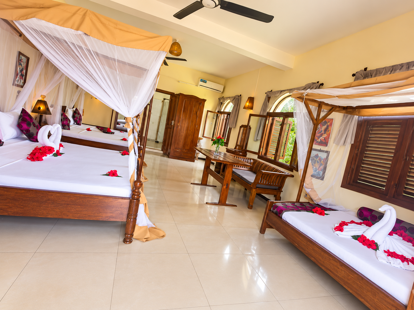 Standard triple room with warm wood furnishings